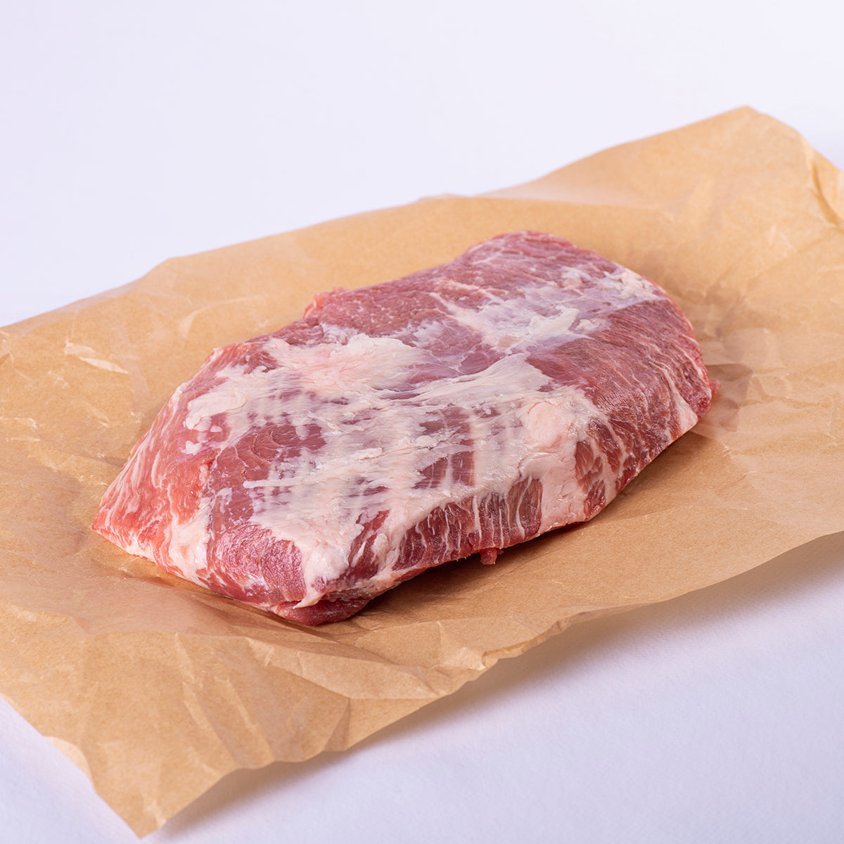 pieza completa de presa iberica sobre papel alimentario