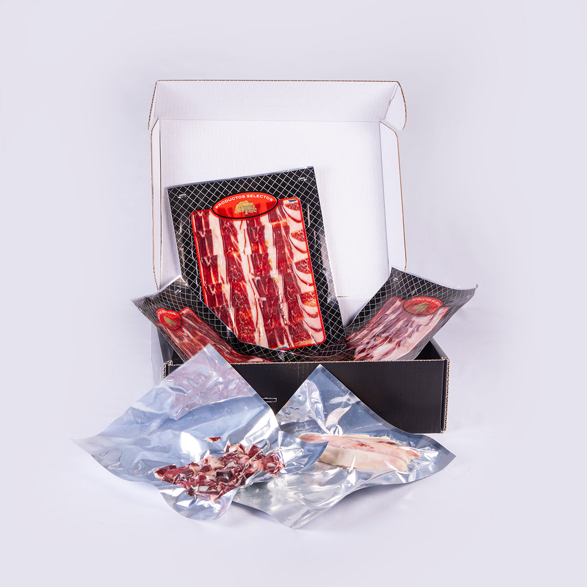 caja con sobres y piezas de jamón ibérico de bellota preparado al corte y envasado al vacio
